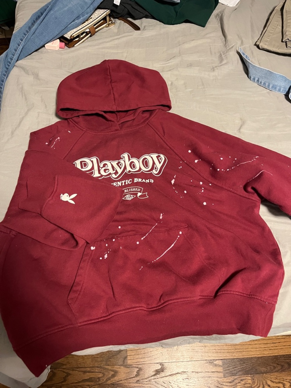 PLAYBOY Burgundy Logo Hoodie with White Paint Splatter